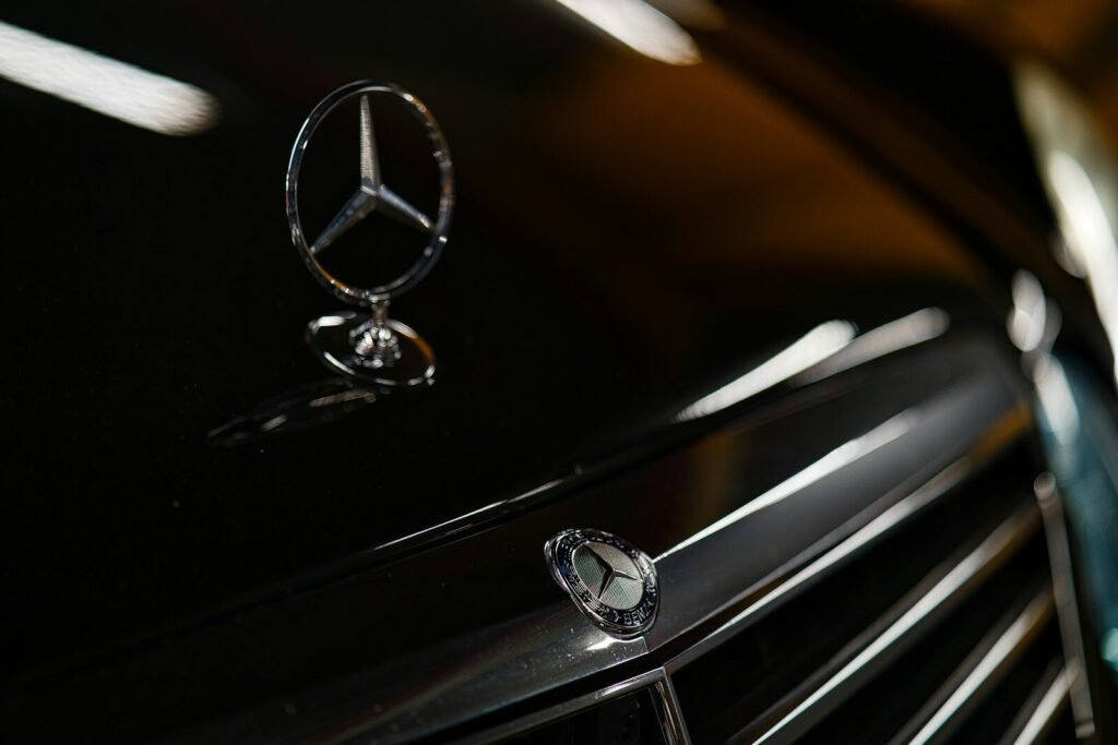 a close up of a mercedes emblem on a car